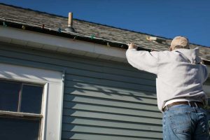 Damage to Roofing and Gutters from Improper installation of holiday lights 